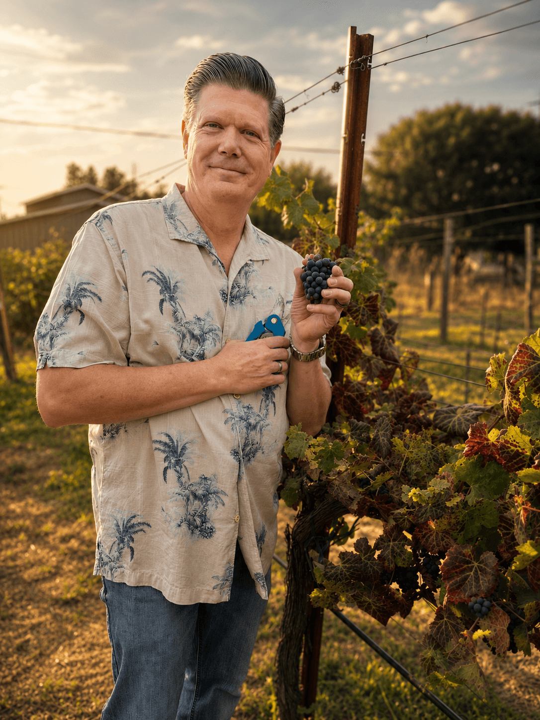 Rob holding freshly picked grapes